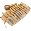 Set of wooden-handled chisels on a tool roll with a white background